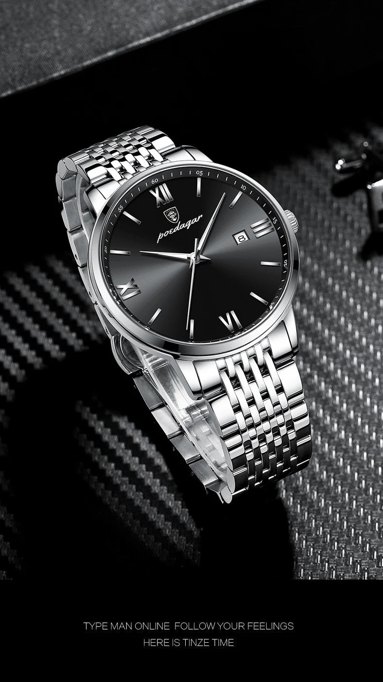 A silver and black quartz watch with a metal band and a luminous hands, displayed on a tan surface.

