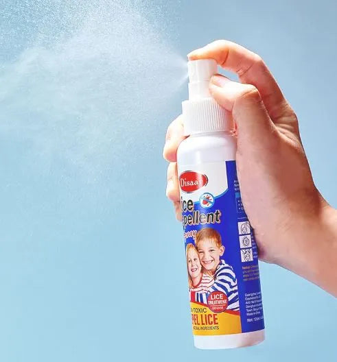 Hand holding a lice spray bottle with a blue background

