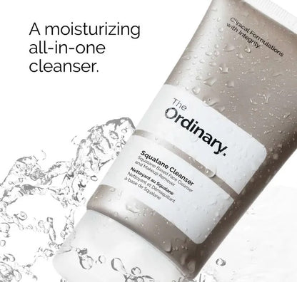 The Ordinary squalane cleanser with water droplets on a white background

