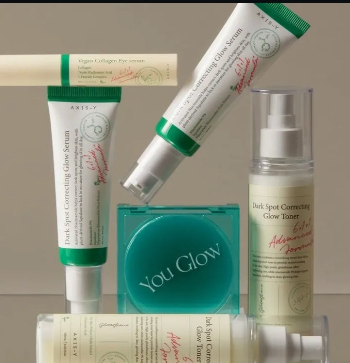 Collection of skincare products with 'You Glow' branding on a neutral background

