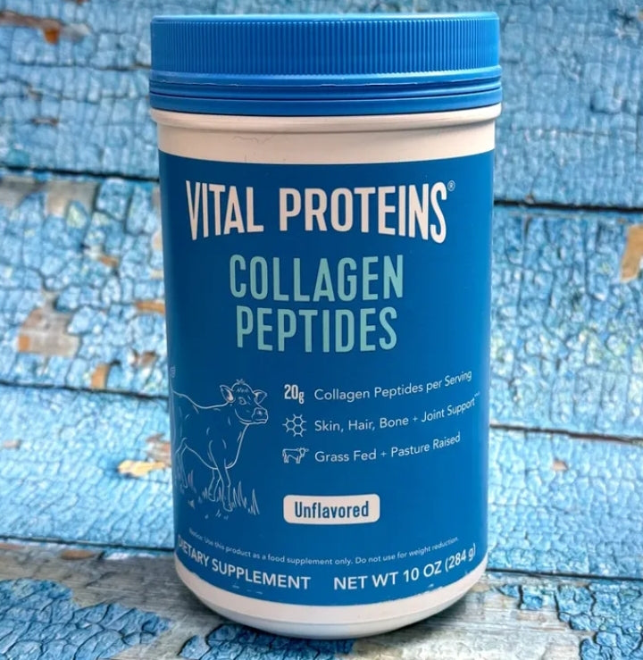 Vital Proteins Collagen Peptides container on a blue wooden background