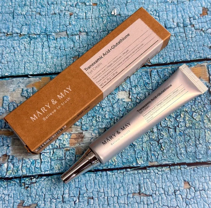 Mary & May skincare product and packaging on a textured blue surface