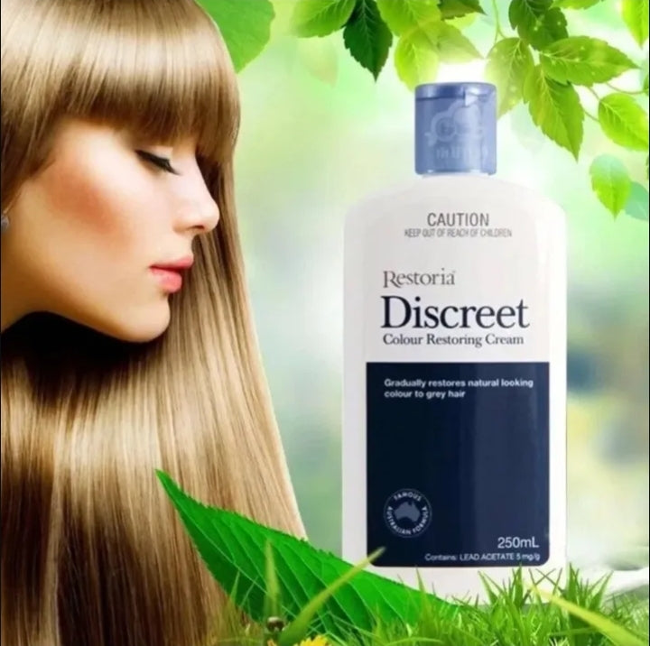 Bottle of Restoria Discreet Colour Restoring Cream with a woman and green leaves in the background

