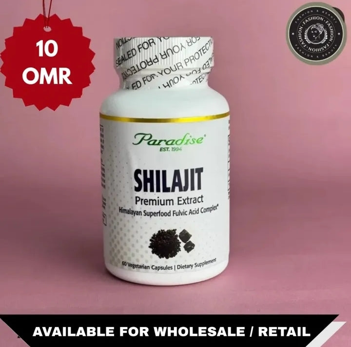 Bottle of Paradise Shilajit Premium Extract on a pink background with text and logos.

