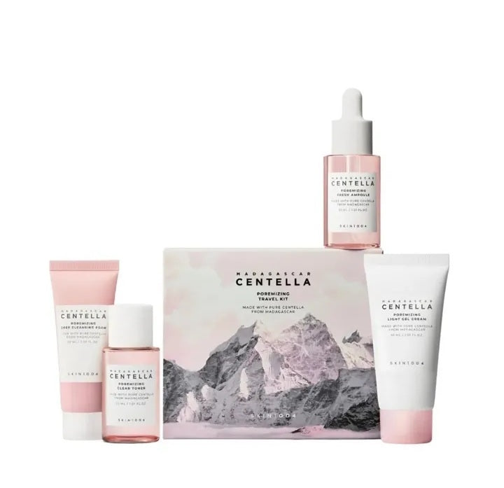 Set of skincare products with a mountain-themed box on a white background