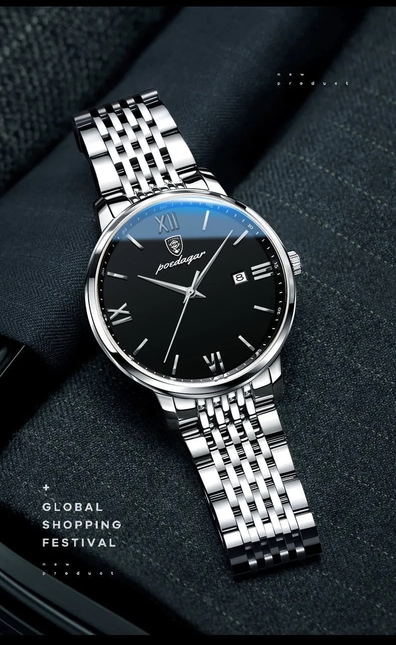 A silver and black quartz watch with a metal band and a luminous hands, displayed on a tan surface.

