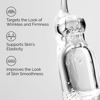 Skincare serum bottle with text highlighting benefits on a light gray background
